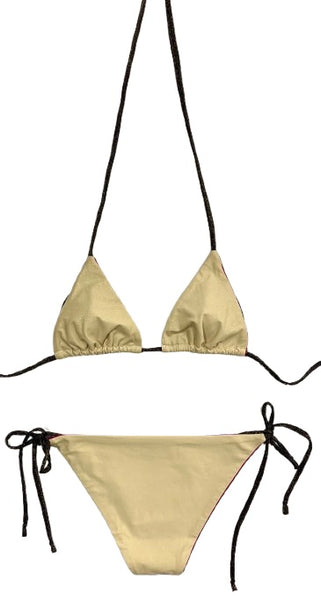 Bikini de cortina beige con laminado de puntos dorados. Braguita triangular de lurex negro por delante y estampado como el de la parte de arriba por detrás